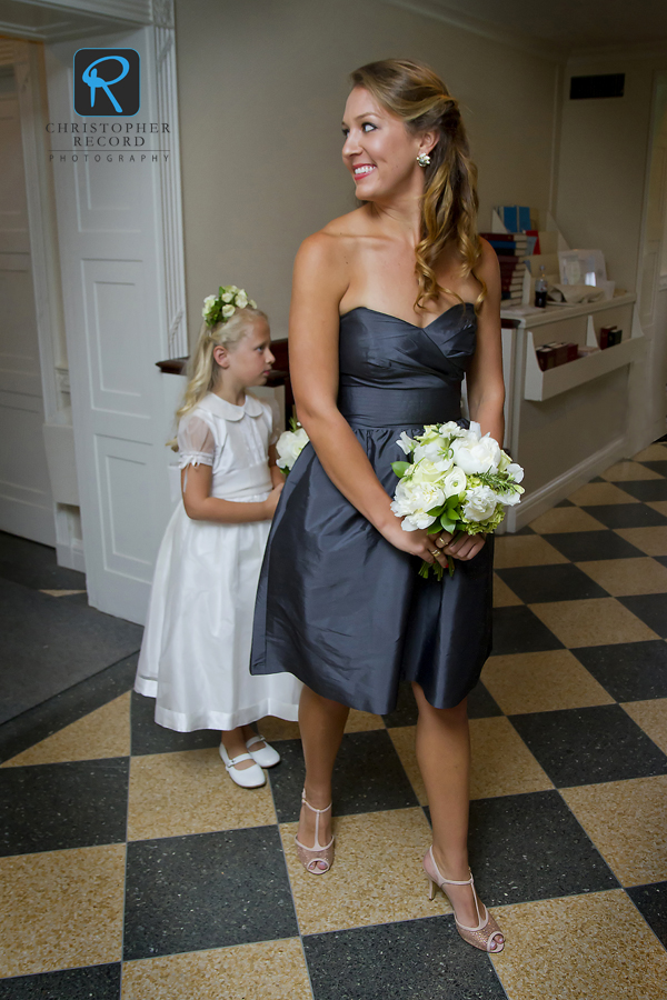 Maid of honor Amy glances back at her sister as she prepares to enter the church