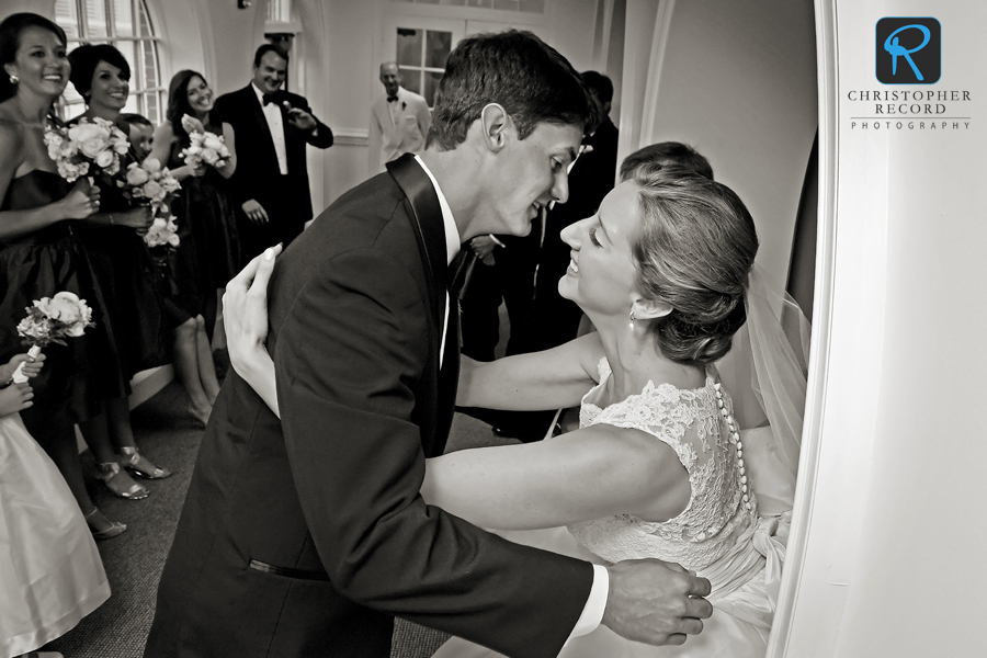 Brother William hugs the bride