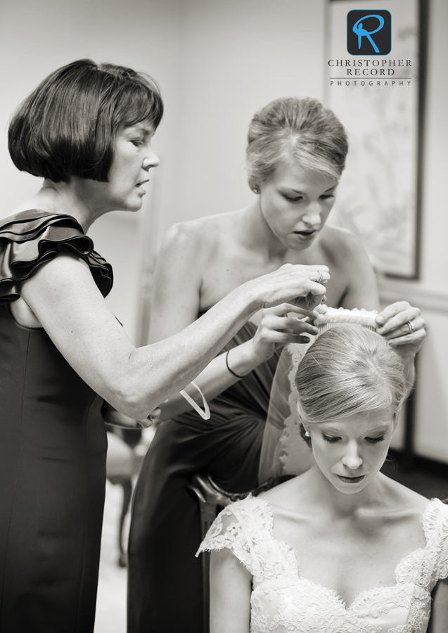 Liz and Sarah fix the veil