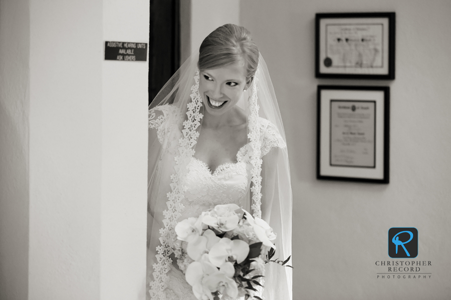 Katie peeks around the corner as the ceremony begins