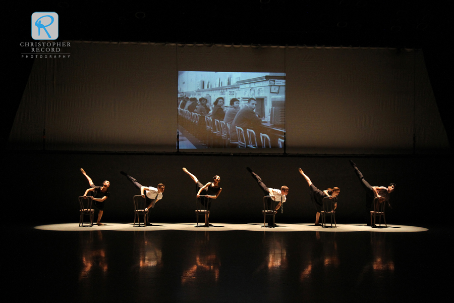 Photographs from the Levine Museum of the New South serve as a backdrop